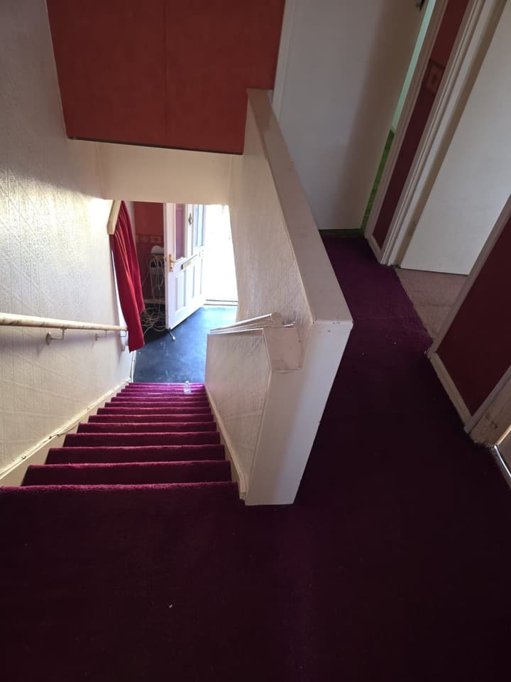 The stairs and hall after the clearance, clear down to the front door
